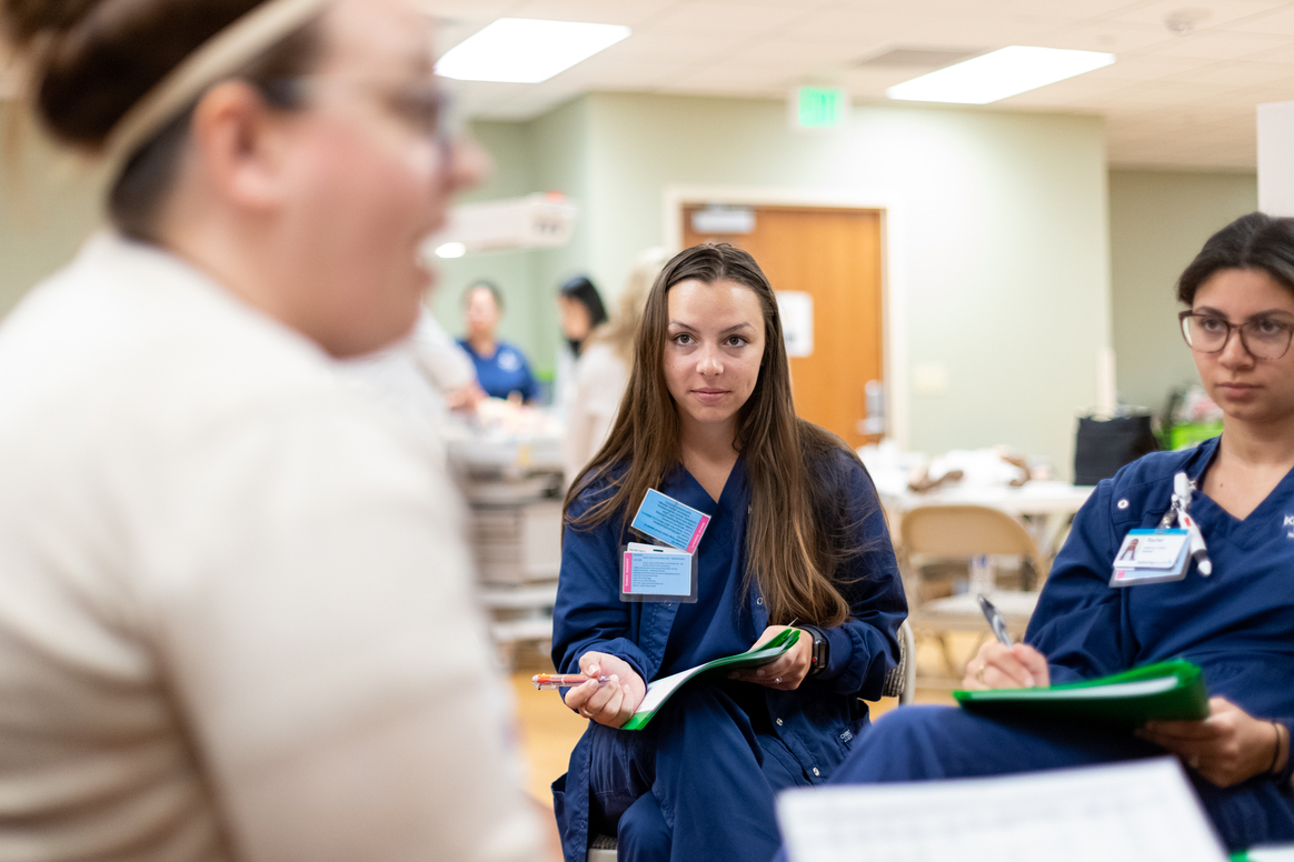 Kettering College Nursing students in the accelerated program (A-BSN) take notes in the simulation lab.